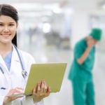 Doctor of Nursing Practice in a hospital hallway with other medical personnel