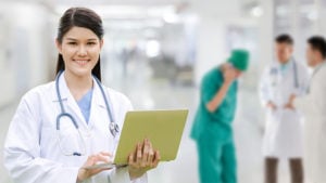 Doctor of Nursing Practice in a hospital hallway with other medical personnel