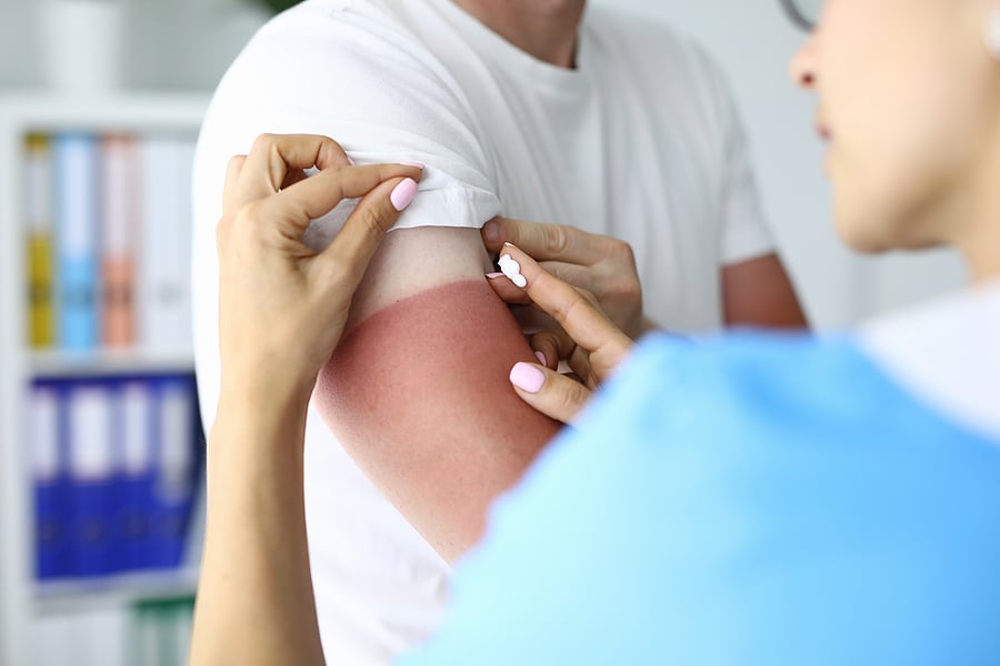 Dermatology nurse practitioner examining patient