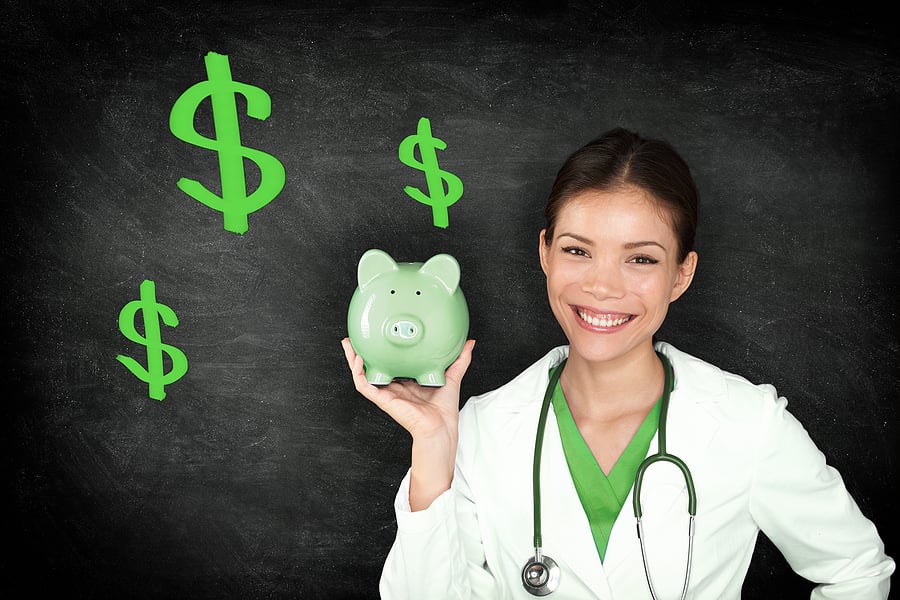 Nurse Practitioner holding up a piggy bank