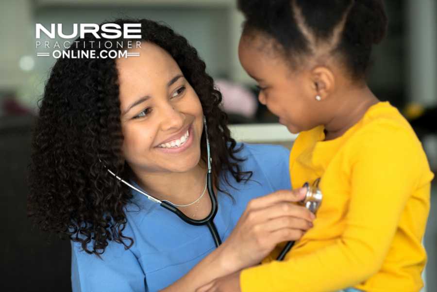 A pediatric ER nurse examines a young patient.