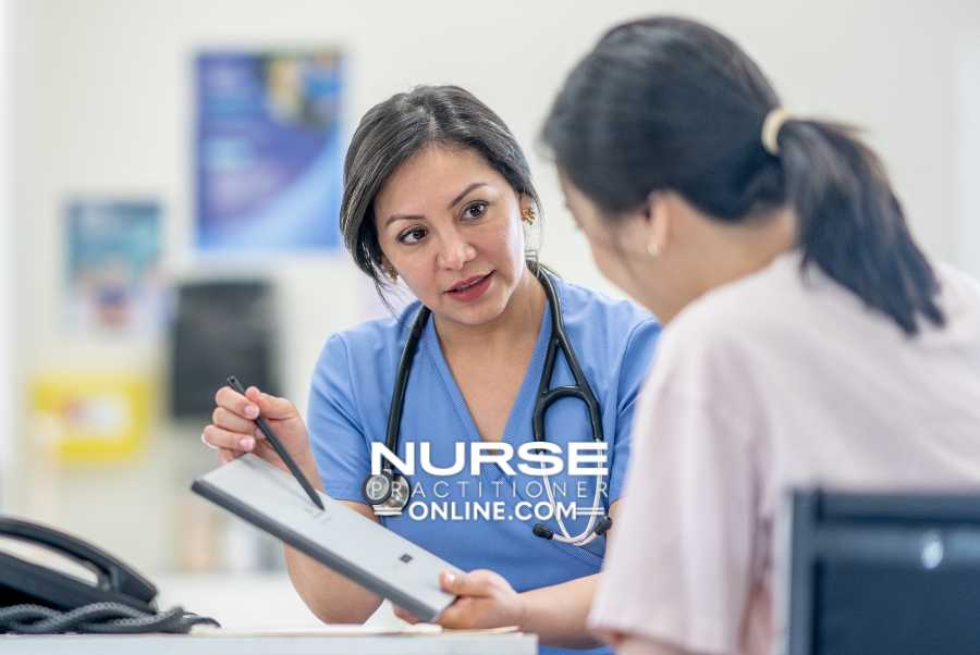 A nurse practitioner meets with a patient in a hospital in Georgia.