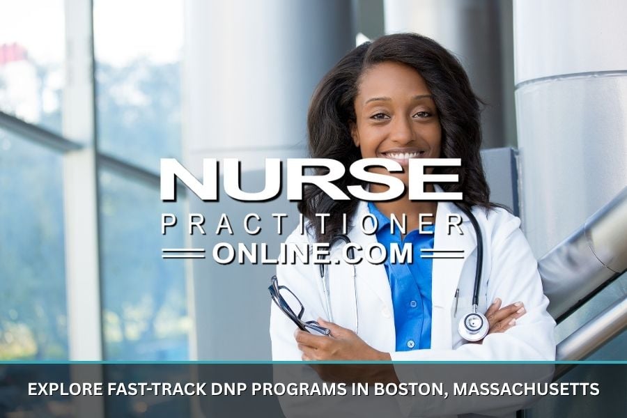 A nurse practitioner stands next to the windows inside of a hospital.
